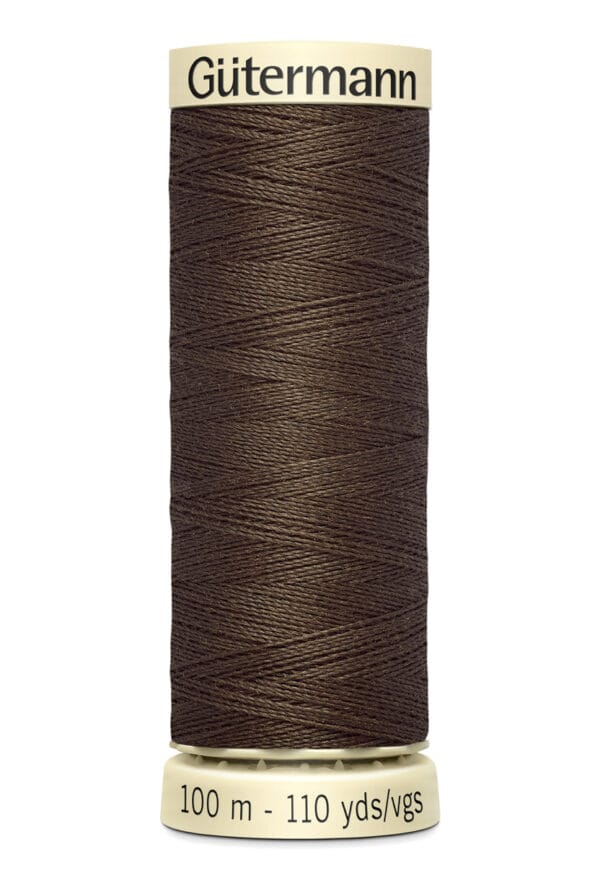 A spool of Gütermann thread in dark brown, labeled for 100 meters or 110 yards. The thread is neatly wound on a cream-colored cylinder with the brand name at the top.