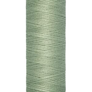 A spool of Gütermann sewing thread in a muted green color. The spool is labeled with "100 m - 110 yds/vgs".