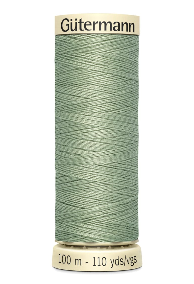 A spool of Gütermann sewing thread in a muted green color. The spool is labeled with "100 m - 110 yds/vgs".