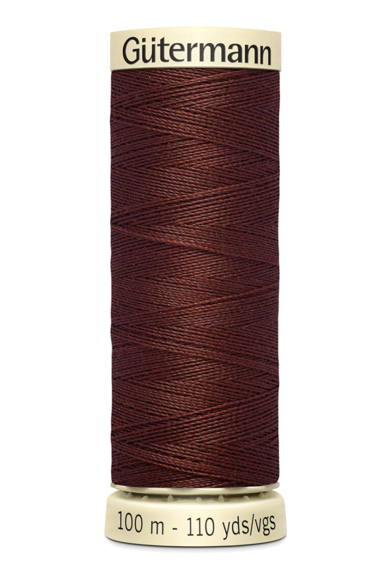 A spool of Gütermann thread, brown in color, with a label at the top. The spool contains 100 meters or 110 yards of thread.