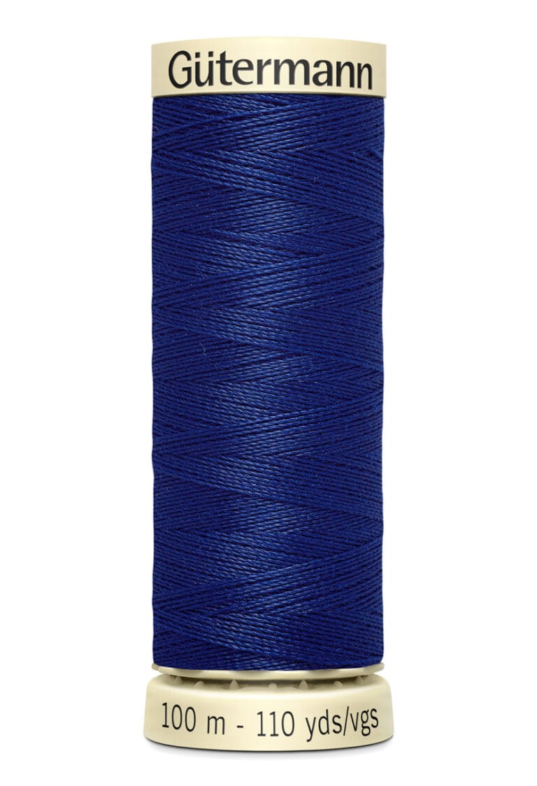 A spool of Gütermann thread in deep blue, with cream-colored caps on the top and bottom. The label reads "100 m - 110 yds/vgs" and features the brand name at the top.