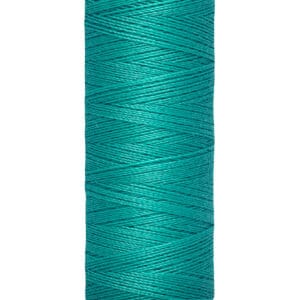 A spool of Gütermann thread, featuring a rich teal color. The spool is labeled with a length of 100 meters (110 yards).