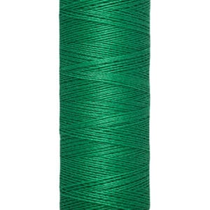 A spool of Gütermann thread, featuring vibrant green thread. The spool label indicates a length of 100 meters or 110 yards.