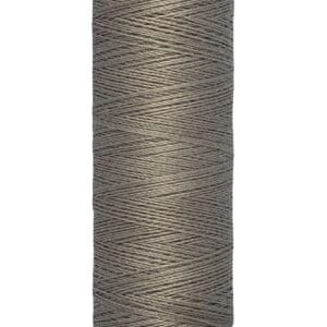 A spool of Gütermann sewing thread, grey in color, with text on the top and base. The base indicates the length as 100 meters or 110 yards. The thread is neatly wound around the spool.
