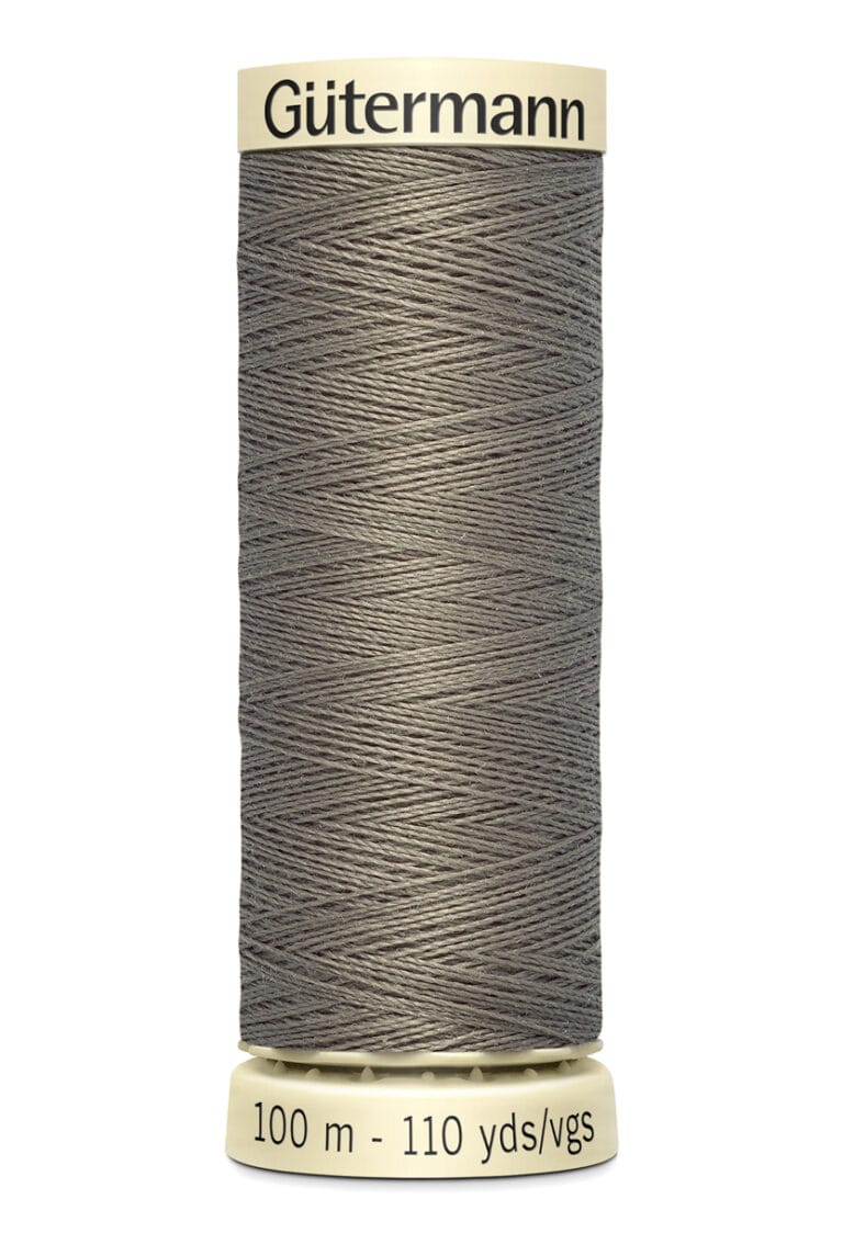 A spool of Gütermann sewing thread, grey in color, with text on the top and base. The base indicates the length as 100 meters or 110 yards. The thread is neatly wound around the spool.