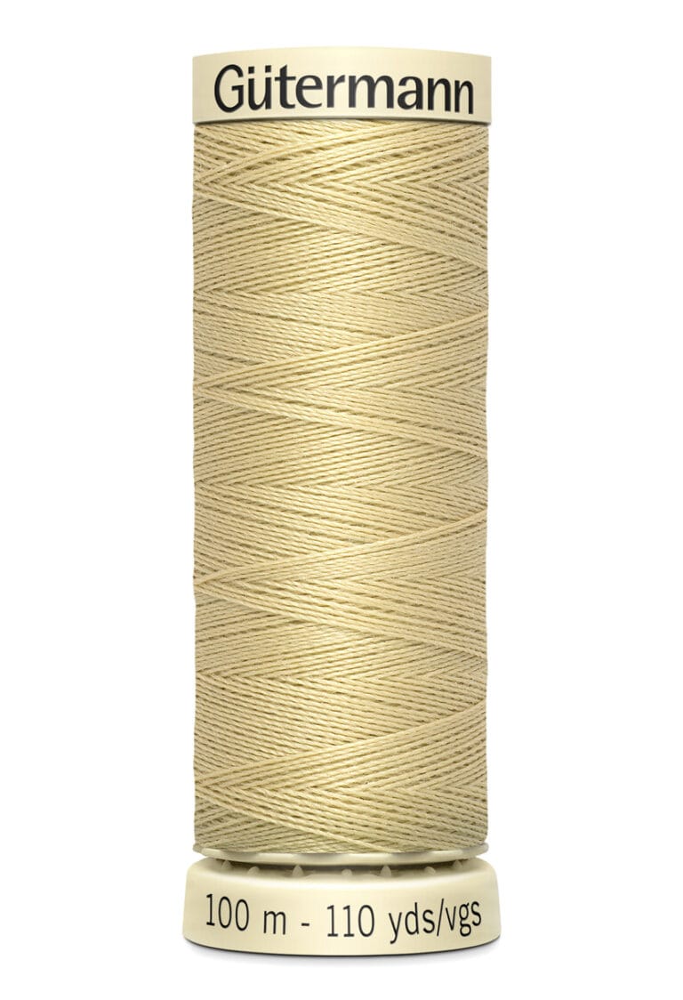 Spool of Gütermann thread in a light beige color, labeled with a length of 100 meters or 110 yards. The label is cream-colored, with black text on the top and bottom.