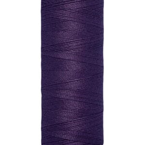 A spool of Gütermann thread in deep purple color, labeled with 100 meters and 110 yards. The thread is neatly wound around the spool.