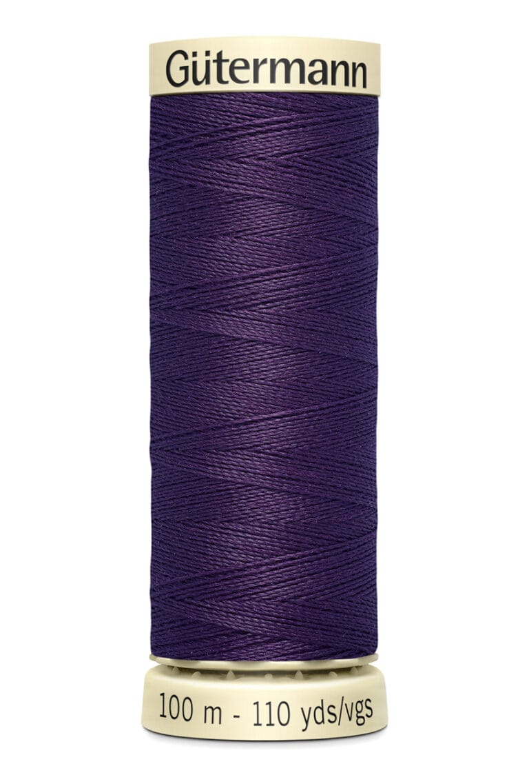 A spool of Gütermann thread in deep purple color, labeled with 100 meters and 110 yards. The thread is neatly wound around the spool.