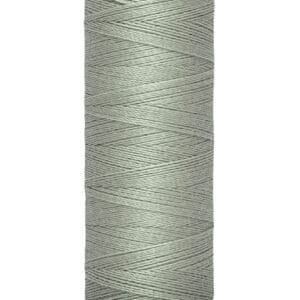 A spool of Gütermann sewing thread, light gray in color, with 100 meters (110 yards) indicated on the label. The spool is cylindrical with beige caps on top and bottom.