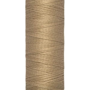 A spool of Gütermann thread in a light brown color stands upright against a white background. The label indicates it is 100 meters (110 yards) long.