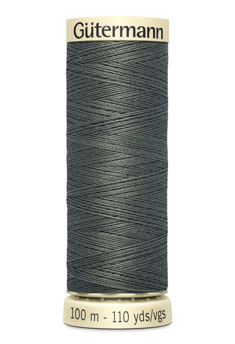 A spool of Gütermann thread in dark teal. The label indicates it is 100 meters or 110 yards long. The thread is tightly wound on a cream-colored spool with black text.