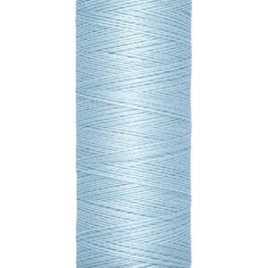 A spool of light blue Gütermann sewing thread on a beige base. The spool label indicates 100 meters and 110 yards. The brand name is visible at the top.