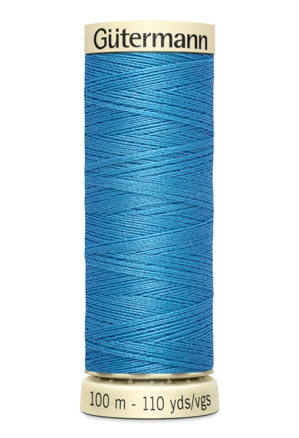 Spool of Gütermann thread in bright blue, labeled 100 meters - 110 yards/vgs, stands vertically against a white background.