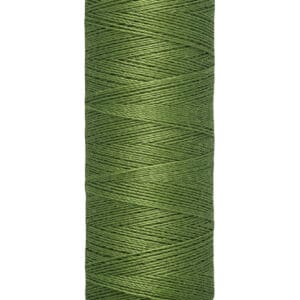 A spool of Gütermann sewing thread in green, labeled with 100 meters and 110 yards. The thread is neatly wound around the spool.