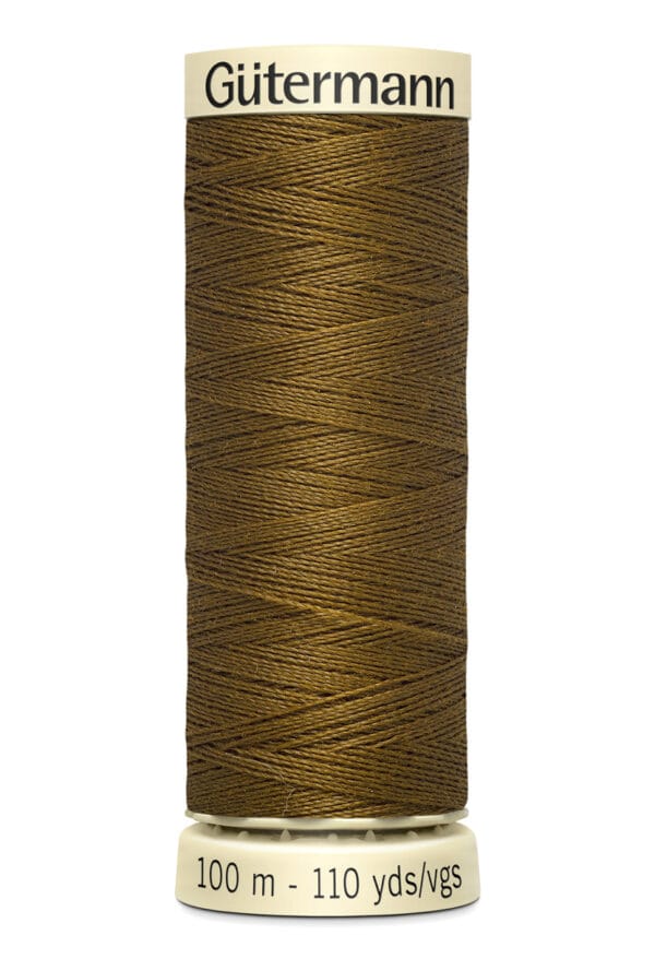 A spool of Gütermann sewing thread, wound with brown thread. The label indicates it's 100 meters and 110 yards in length.