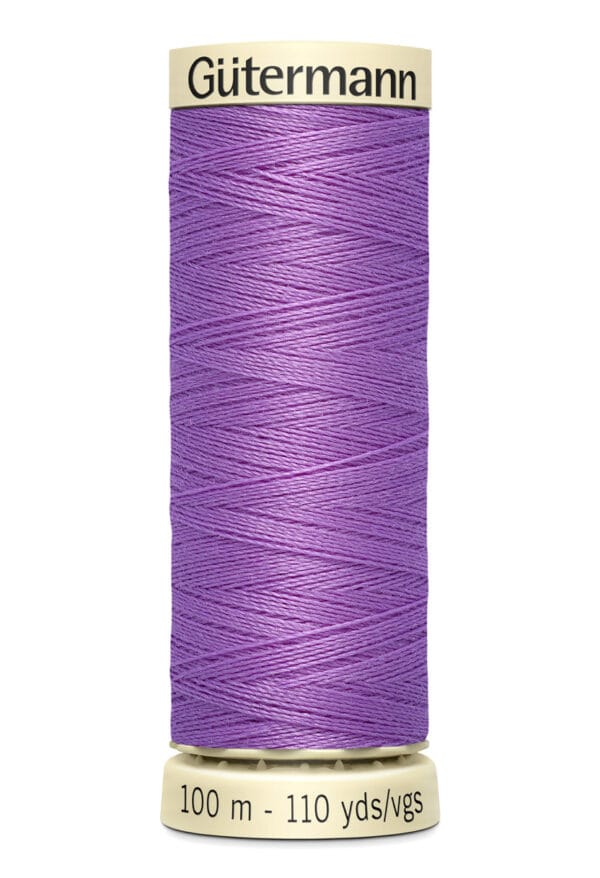 A spool of Gütermann thread, colored purple, with a label indicating it is 100 meters or 110 yards long. The spool is vertically positioned against a white background.