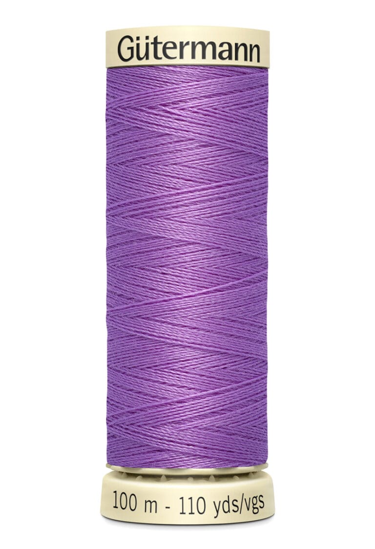 A spool of Gütermann thread, colored purple, with a label indicating it is 100 meters or 110 yards long. The spool is vertically positioned against a white background.