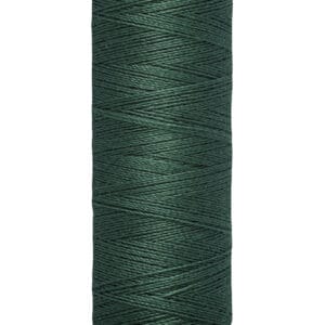 A spool of Gütermann thread in dark green. The spool shows the brand name at the top and indicates it contains 100 meters or 110 yards of thread.