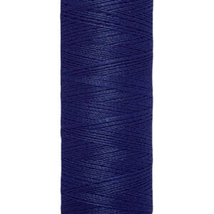 A spool of Gütermann sewing thread in dark blue, with a beige top and bottom. The label reads "100 m - 110 yds/vgs.
