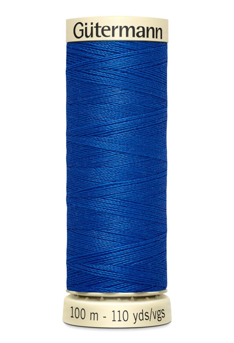 Spool of Gütermann blue sewing thread with 100 meters or 110 yards indicated on the base.