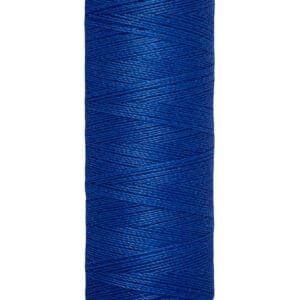 A spool of Gütermann thread, displaying 100 meters and 110 yards, in royal blue color. The thread is tightly wound on a cream-colored cylindrical spool.