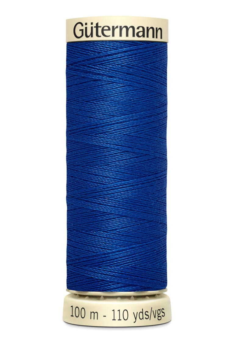 A spool of Gütermann thread, displaying 100 meters and 110 yards, in royal blue color. The thread is tightly wound on a cream-colored cylindrical spool.