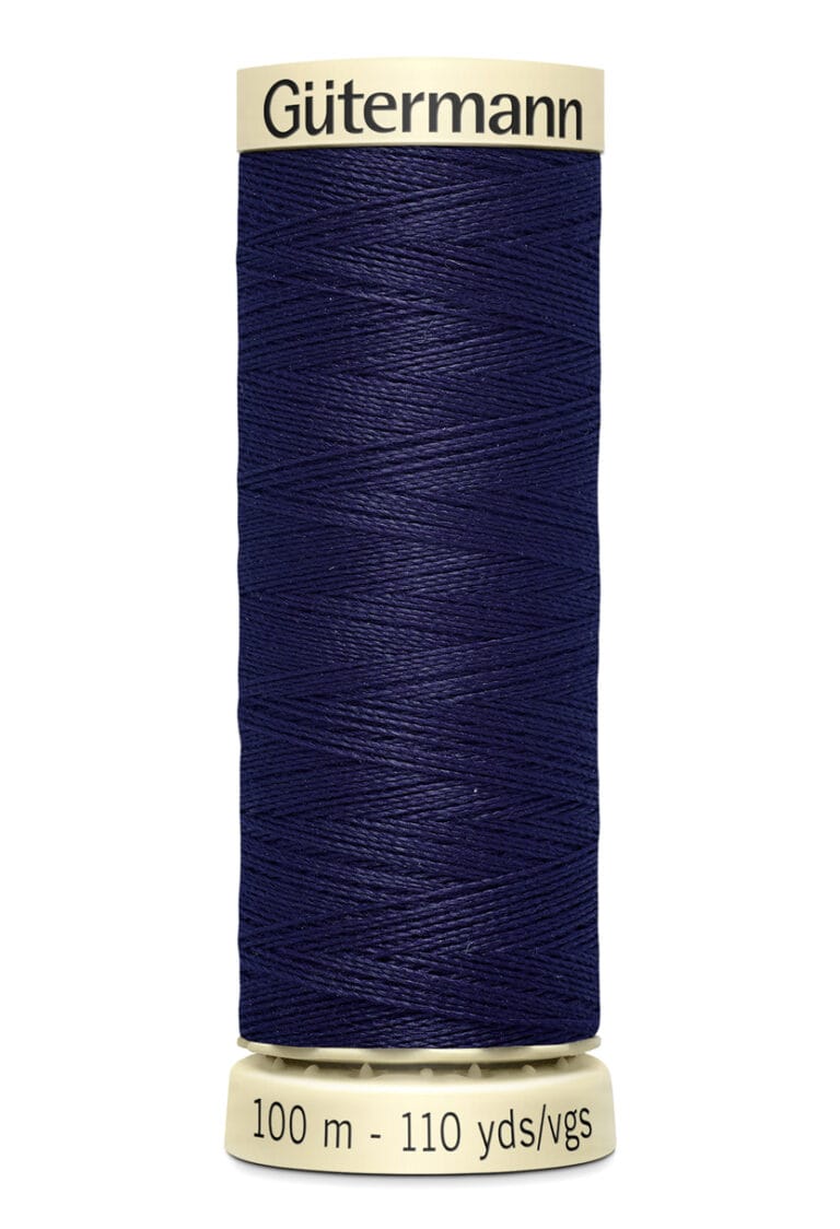 A spool of Gütermann navy blue sewing thread, showing the brand name at the top. The label at the base indicates 100 meters, or 110 yards. The thread is neatly wound around the spool.