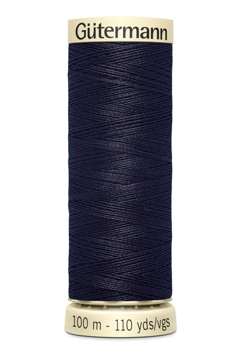 A spool of Gütermann dark blue sewing thread with cream-colored ends. The label indicates a length of 100 meters or 110 yards.