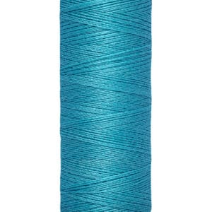 A spool of Gütermann sewing thread is shown. The thread is teal-colored, wrapped neatly around a beige spool. The label indicates it contains 100 meters or 110 yards of thread.