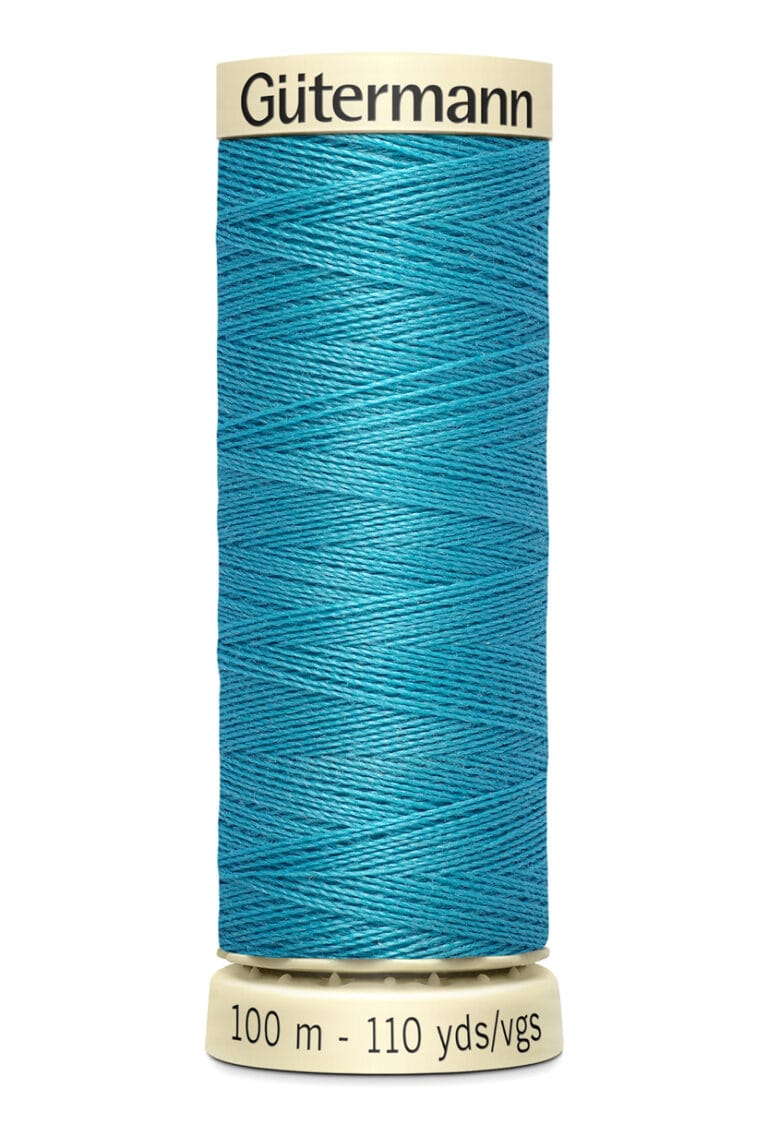 A spool of Gütermann sewing thread is shown. The thread is teal-colored, wrapped neatly around a beige spool. The label indicates it contains 100 meters or 110 yards of thread.