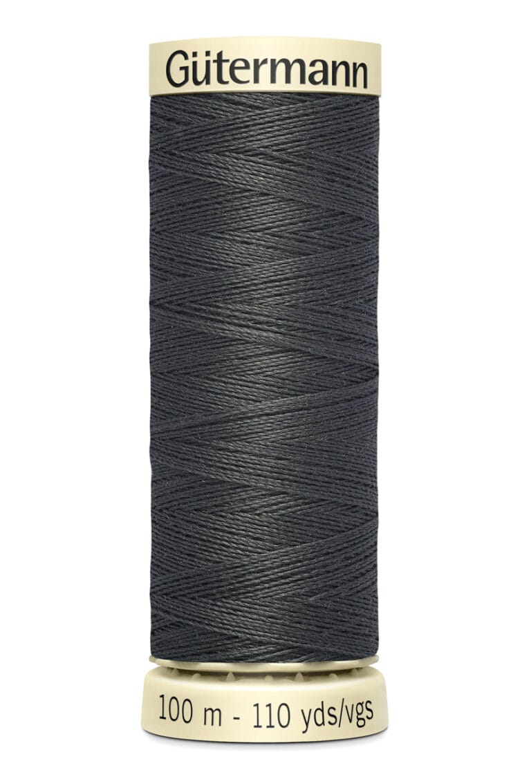 A spool of Gütermann black sewing thread with 100 meters (110 yards) of thread. The spool is cylindrical, with cream-colored ends featuring the brand name and measurement details.