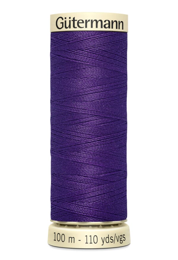 A spool of Gütermann sewing thread in a vibrant purple color. The label indicates the length as 100 meters or 110 yards. The thread is neatly wound on a beige spool.