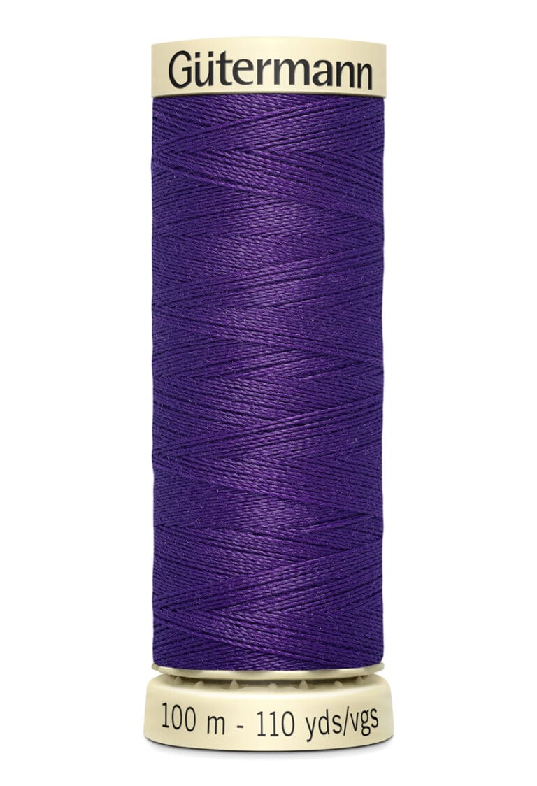 A spool of Gütermann sewing thread in a vibrant purple color. The label indicates the length as 100 meters or 110 yards. The thread is neatly wound on a beige spool.