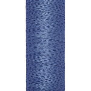 A spool of Gutermann blue sewing thread, labeled with "100 m - 110 yds" on the base.