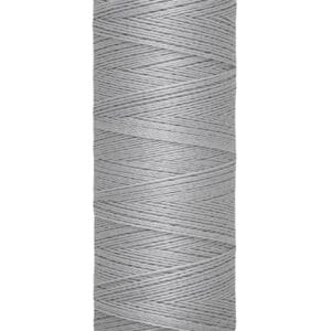 A spool of Gütermann thread, light gray in color, with 100 meters (110 yards) of polyester material. The spool is cylindrical with labeled ends displaying the brand name and thread length.