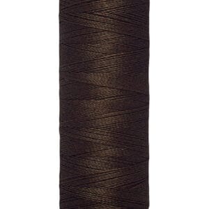 A spool of Gütermann sewing thread, featuring dark brown thread tightly wound around a cylindrical spool. The label displays "100 m - 110 yds/vgs.