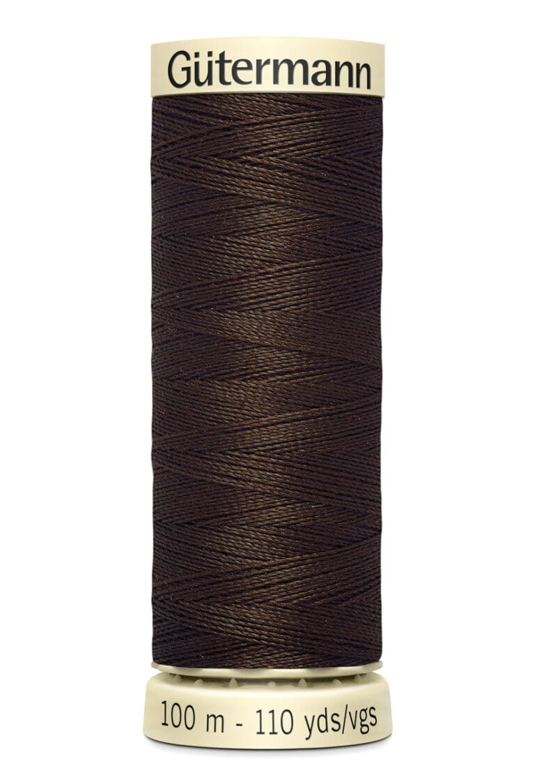 A spool of Gütermann sewing thread, featuring dark brown thread tightly wound around a cylindrical spool. The label displays "100 m - 110 yds/vgs.