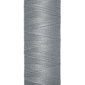 A spool of Gütermann gray sewing thread, labeled as 100 meters (110 yards). The thread is tightly wound around a beige spool with black text.