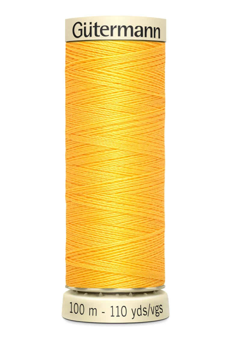 A spool of Gütermann polyester thread in bright orange. The label indicates a length of 100 meters or 110 yards.