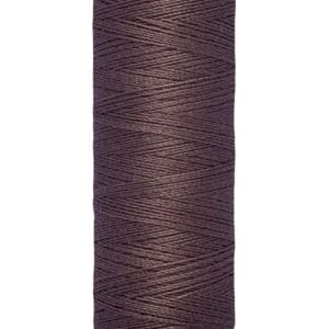 A spool of Gütermann sewing thread in dark brown, labeled for 100 meters or 110 yards. The spool is cylindrical with a beige top and bottom.