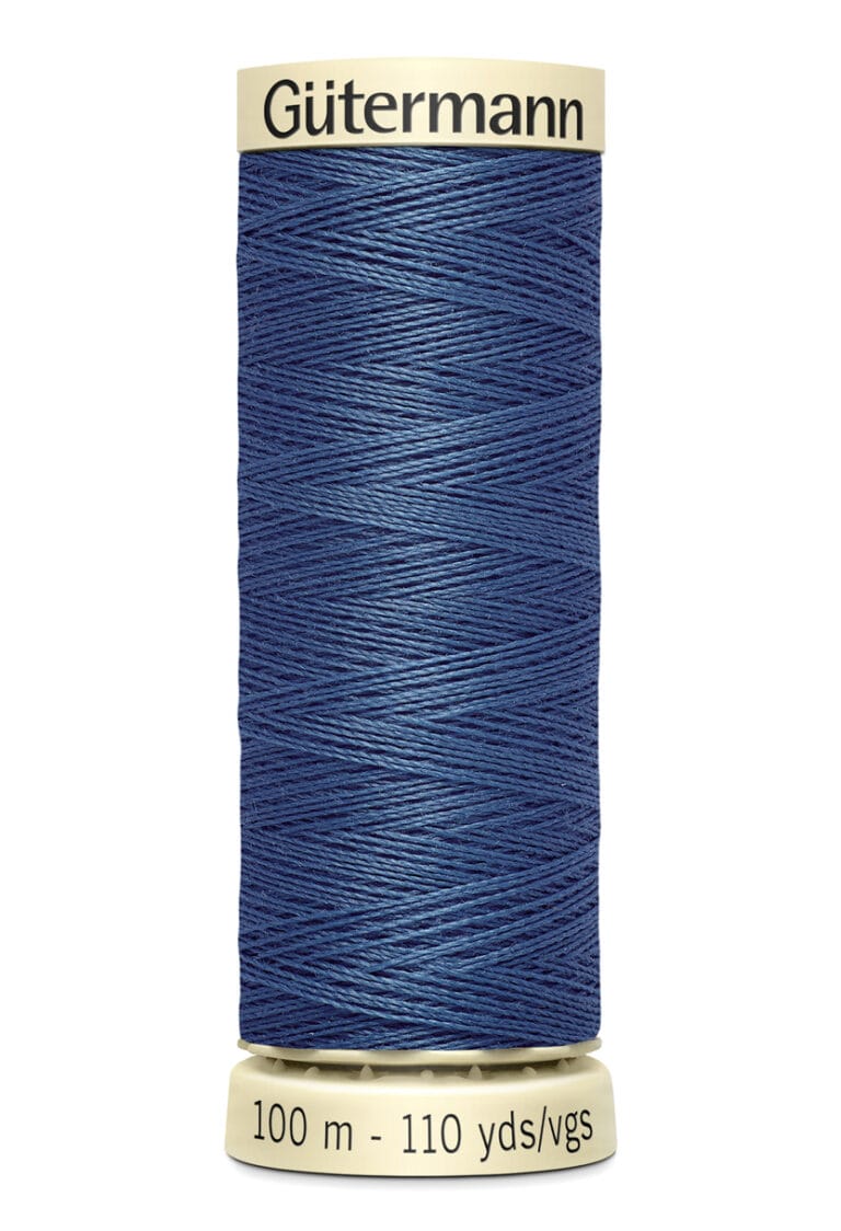 A spool of Gütermann dark blue sewing thread, labeled as 100 meters or 110 yards. The spool has a cream-colored top and base.