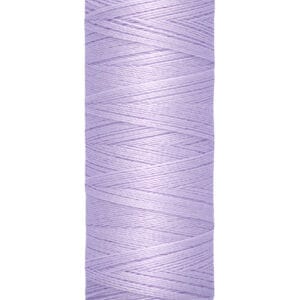 A spool of Gütermann sewing thread in light purple. The label indicates it is 100 meters or 110 yards long. The thread is tightly wound around a cream-colored spool.