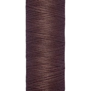 A spool of Gütermann thread in a rich brown color, labeled with "100 m - 110 yds/vgs" on the bottom. The spool is cylindrical and cream-colored at the top and bottom.