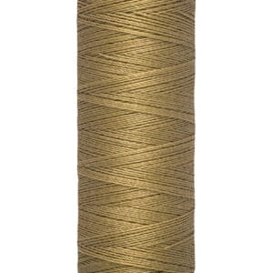 A spool of Gütermann sewing thread in a light brown color. The label reads "Gütermann" at the top and "100 m - 110 yds/vgs" at the bottom, indicating the length of the thread.