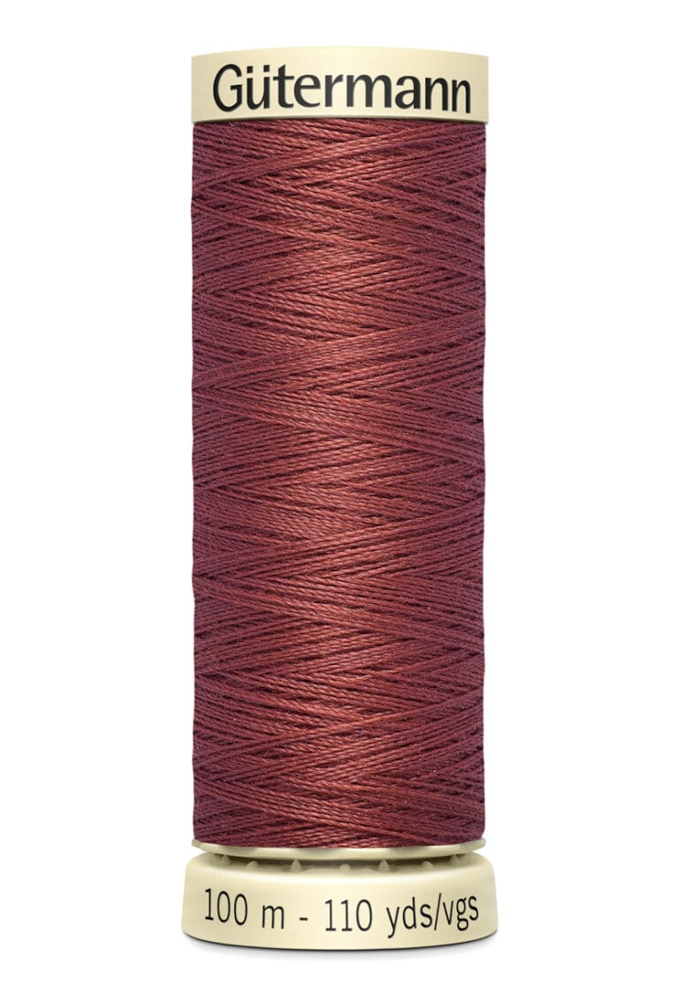 A spool of Gütermann thread in a deep brown color. The spool is neutral in color and shows measurements of 100 meters and 110 yards.