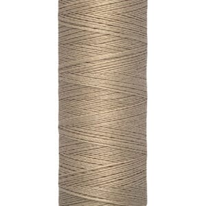 A spool of Gütermann sewing thread in light brown is shown. The spool label indicates it contains 100 meters or 110 yards of thread.
