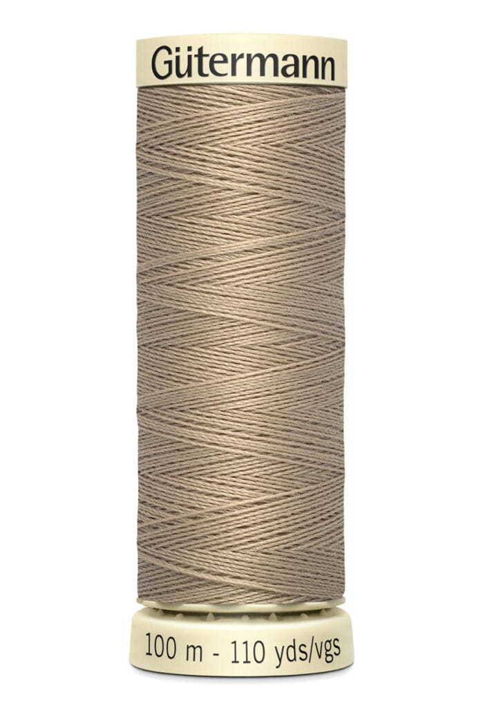 A spool of Gütermann sewing thread in light brown is shown. The spool label indicates it contains 100 meters or 110 yards of thread.