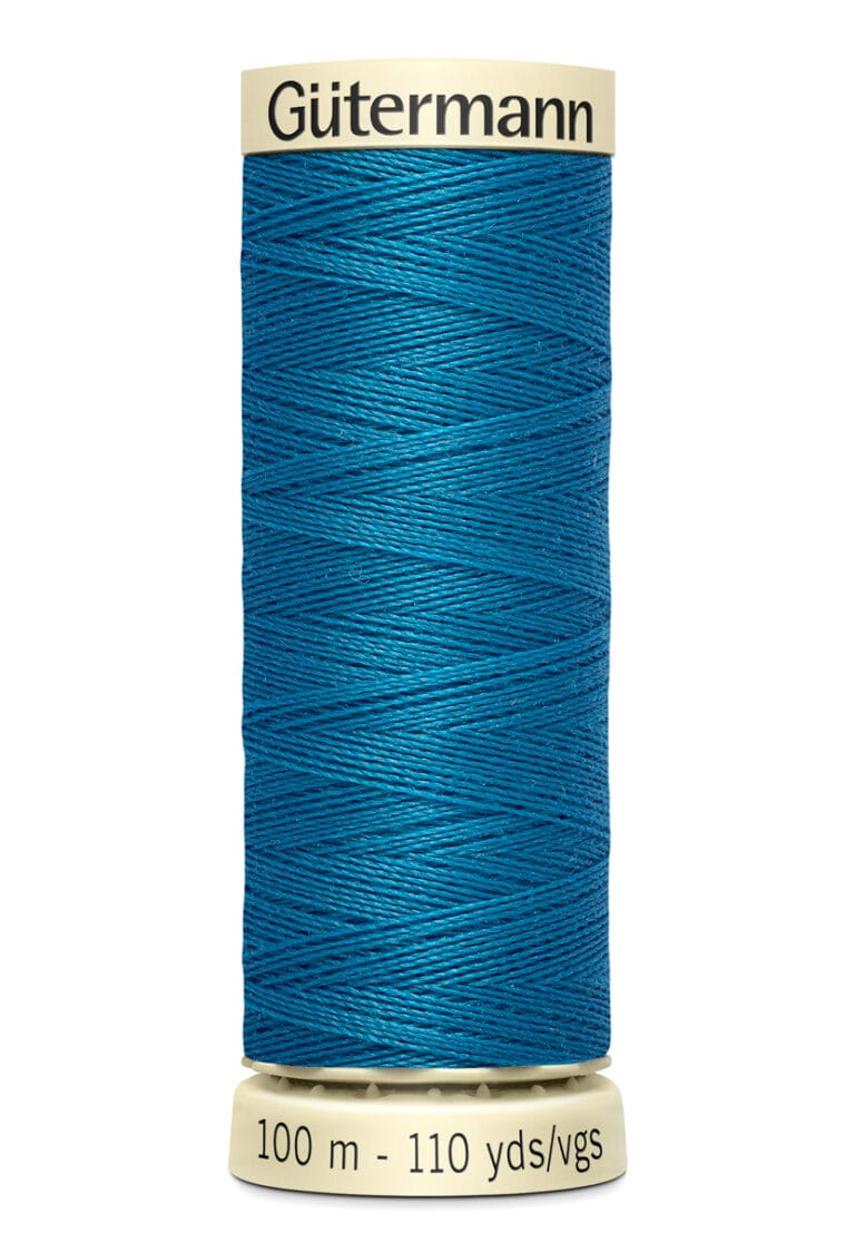 A spool of Gütermann thread in vibrant blue. The spool holds 100 meters (110 yards) of thread. The ends of the spool are cream-colored, and the brand name is printed on the top.