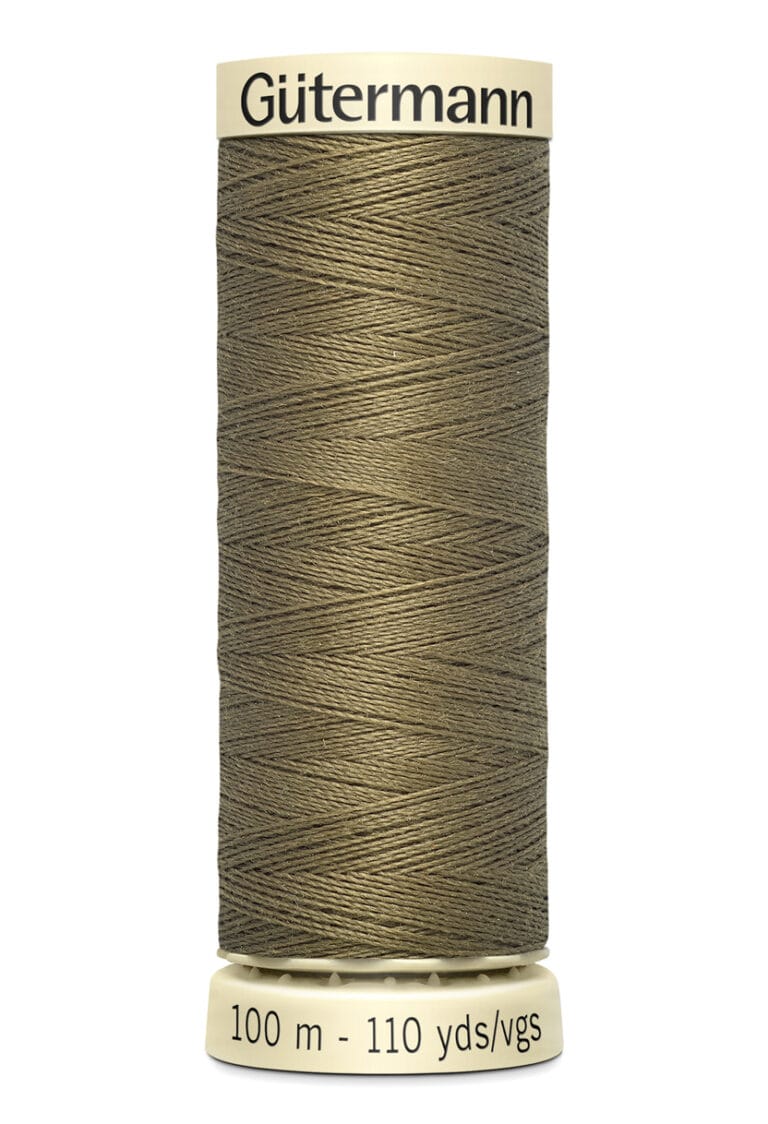 A spool of Gütermann thread, olive green in color, with 100 meters (110 yards) of thread. The spool is off-white with a label at the top and bottom displaying the brand name and length.