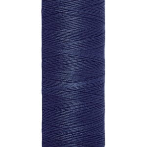 A spool of Gütermann sewing thread in navy blue. The label shows it contains 100 meters (110 yards) of thread. The spool is cylindrical with a beige top and bottom.